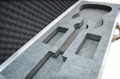 Open custom heavy duty bass guitar flight case with grey CNC cut foam insert
