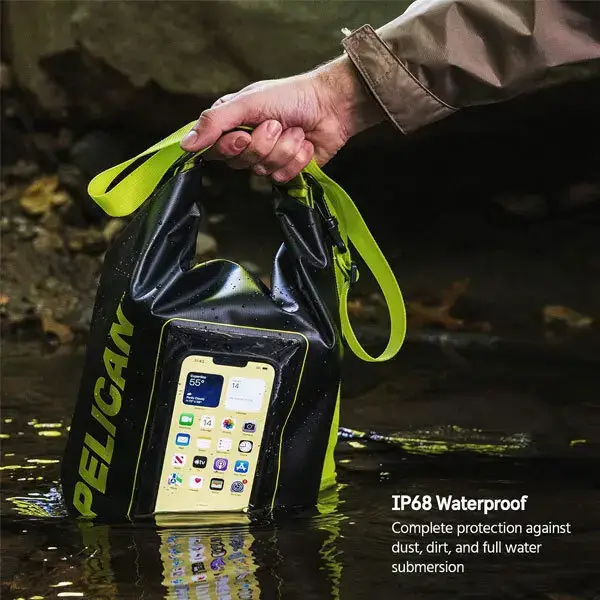 pp050444 5 Pelican Marine waterproof dry bag in black with high-vis yellow straps held in water