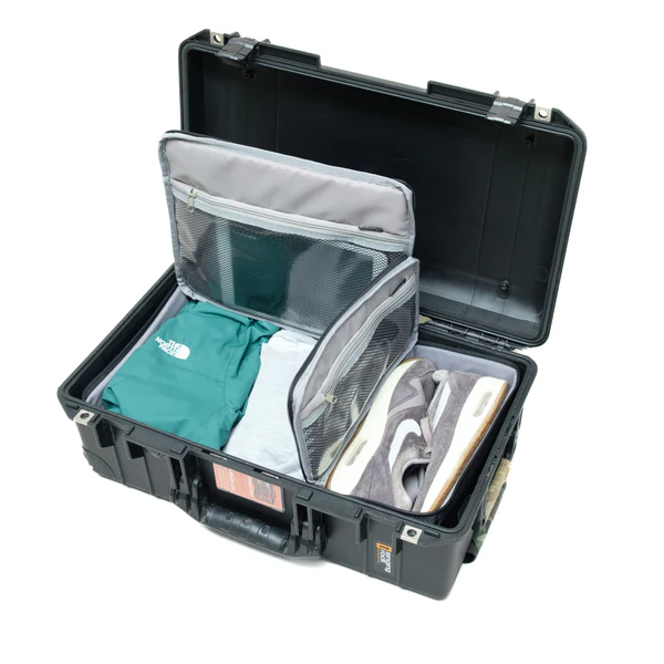 in1519tr 1 A-MoDe IN1519TR travel insert inside an open black hard case organized with clothing and shoes